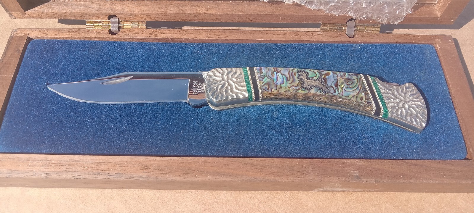 Buck 110 Collectible Knife Brian Yellowhorse Custom Abalone Shell Deer Shield Buck 110 Collectible Knife Brian Yellowhorse Custom Abalone Shell Deer Shield