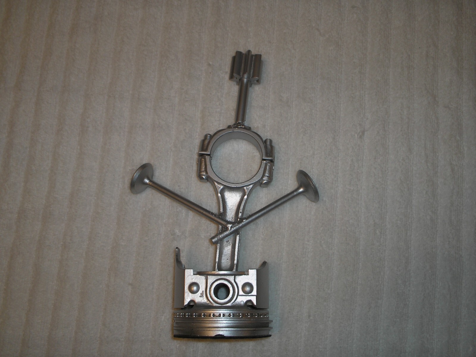 This is a Piston art ornament made from a rod & valve's