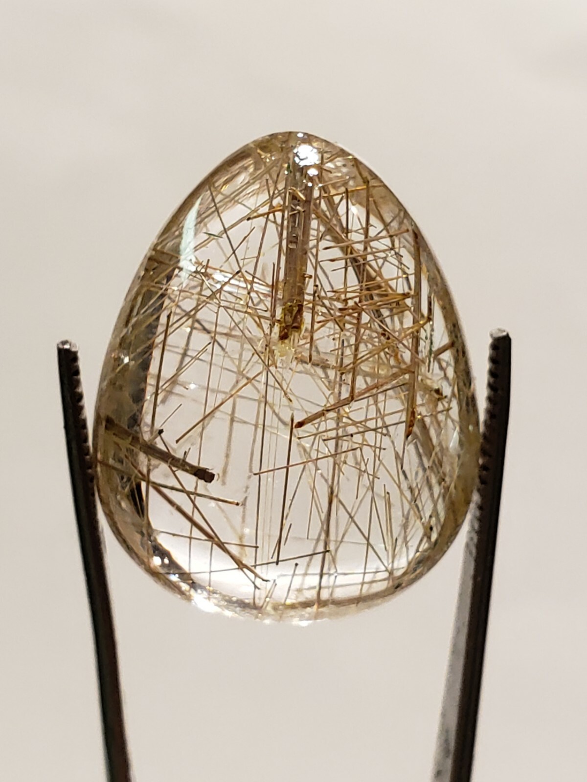 100% Natural very beautiful Pear shaped Rutilated Quartz with Gold Inclusions. 100% Natural very beautiful Pear shaped Rutilated Quartz with Gold Inclusions.