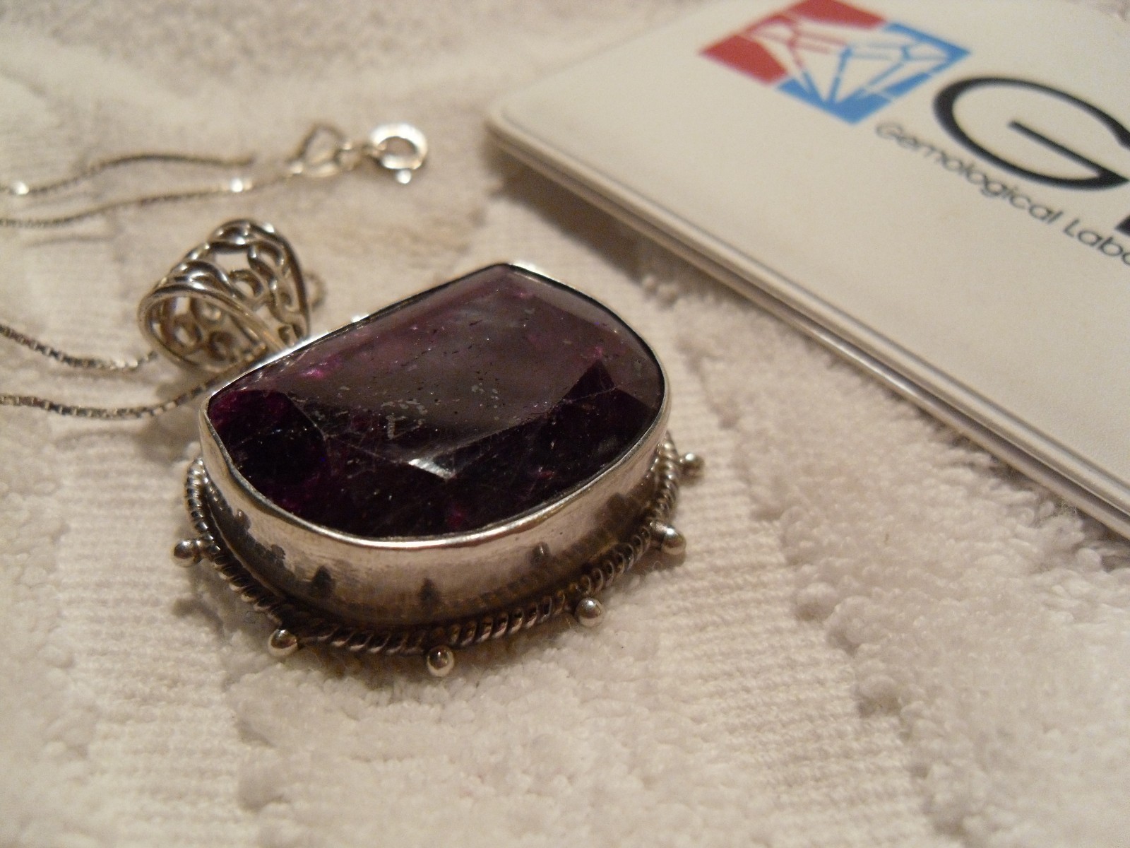 Stunning 50 carat pigeon-blood-red ruby half moon pendant Stunning 50 carat pigeon-blood-red ruby half moon pendant