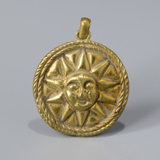 Ancient Gold Pendant with Radiant Sun and Face Motif picture